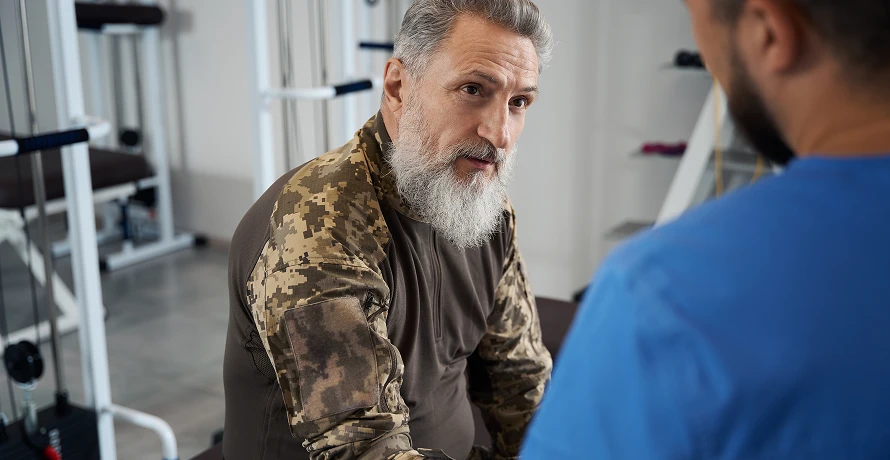 A veteran in conversation with a clinician